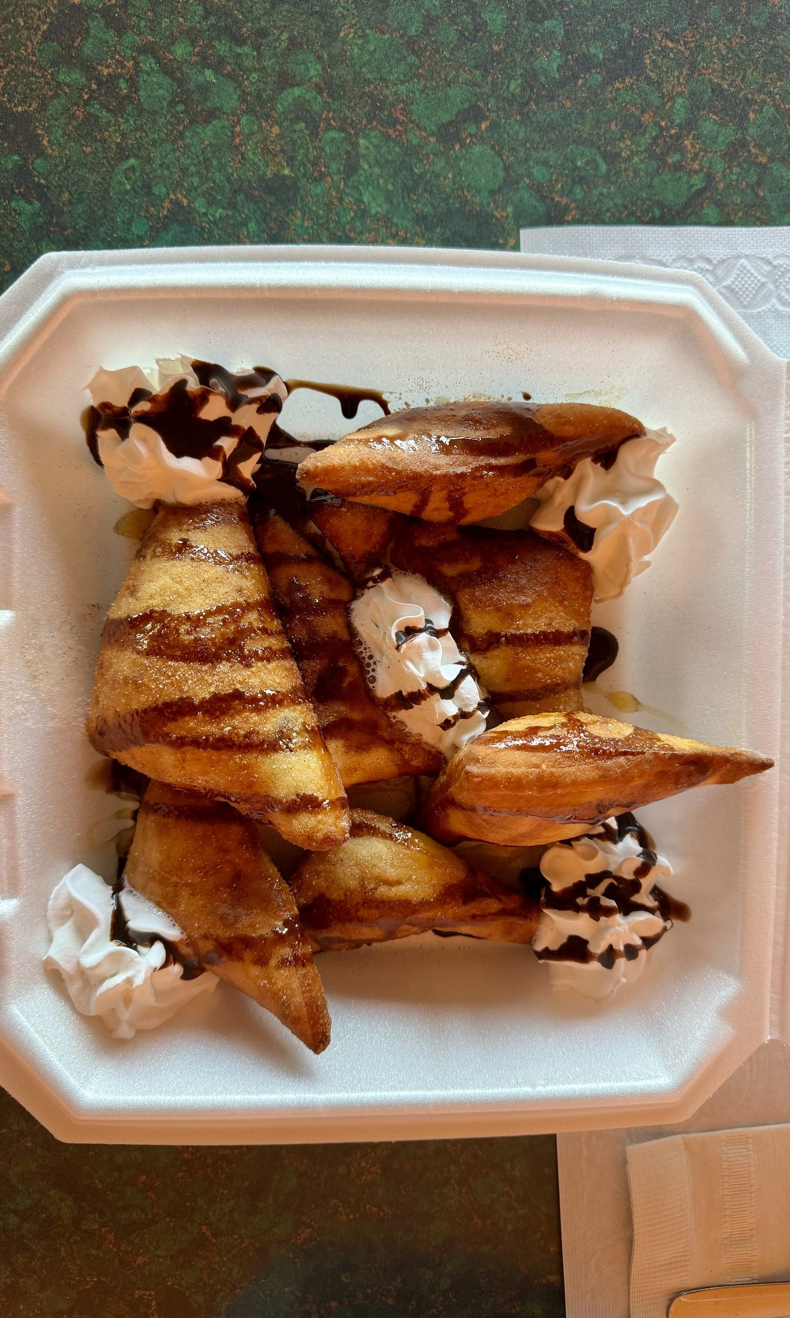 Sopapillas with whipped cream and chocolate